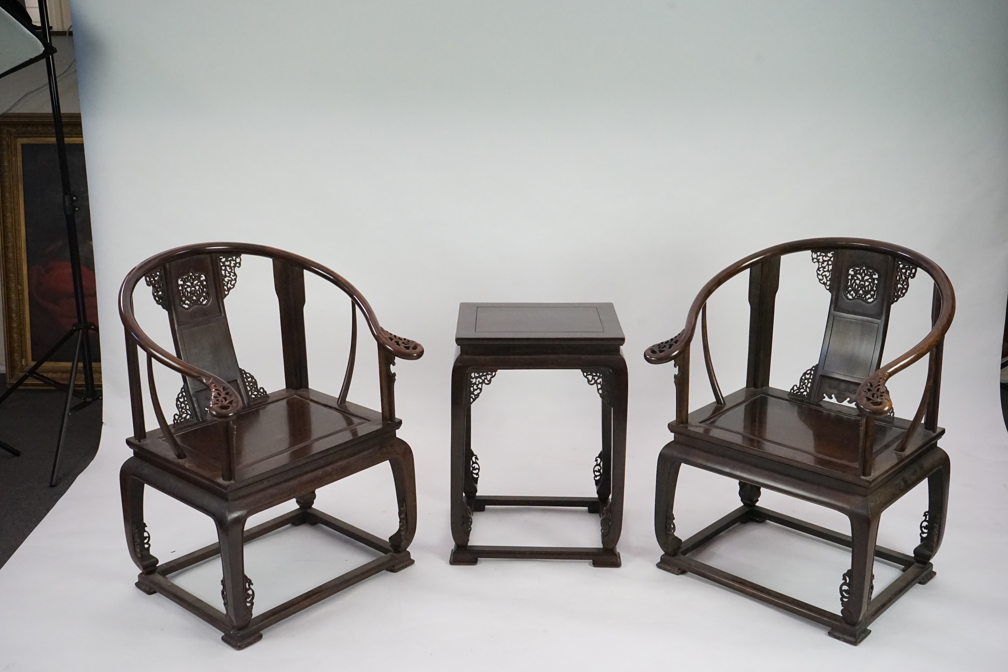 A pair of Chinese jichimu horseshoe shaped armchairs and a matching table, 19th/20th century